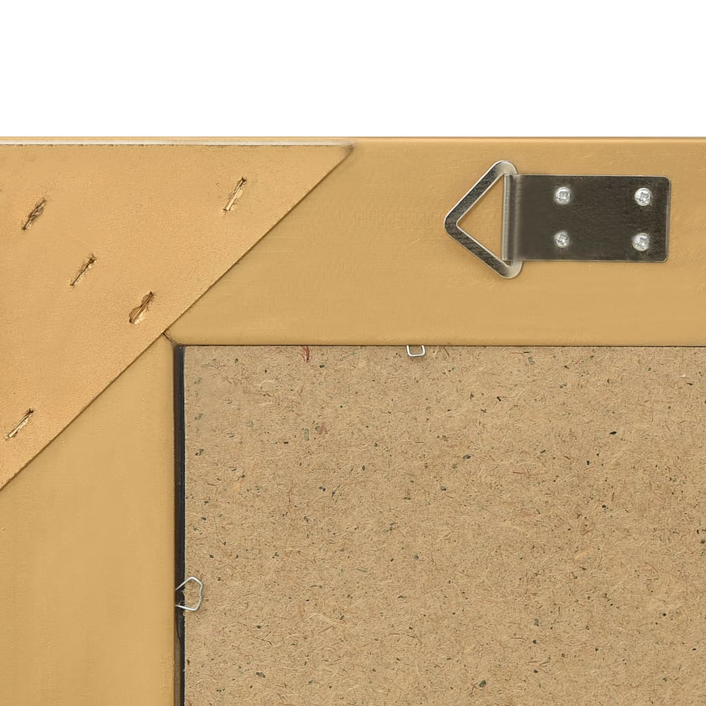 Back of a gold rectangular mirror with hanging hardware and a particle board backing.