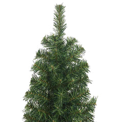 An 8 ft slim artificial Christmas tree with green PVC branches on a steel stand.
