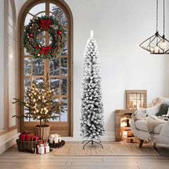 A 6 ft slim artificial Christmas tree with flocked snow on green PVC branches, standing in a cozy room.