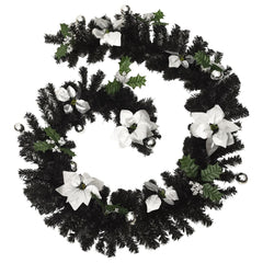 Black PVC Christmas garland with white poinsettias, bells, holly, and integrated LED lights, 8.9 feet long.