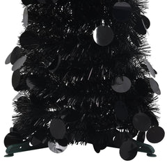 A 6 ft black pop-up artificial Christmas tree made of PET with sequin accents.