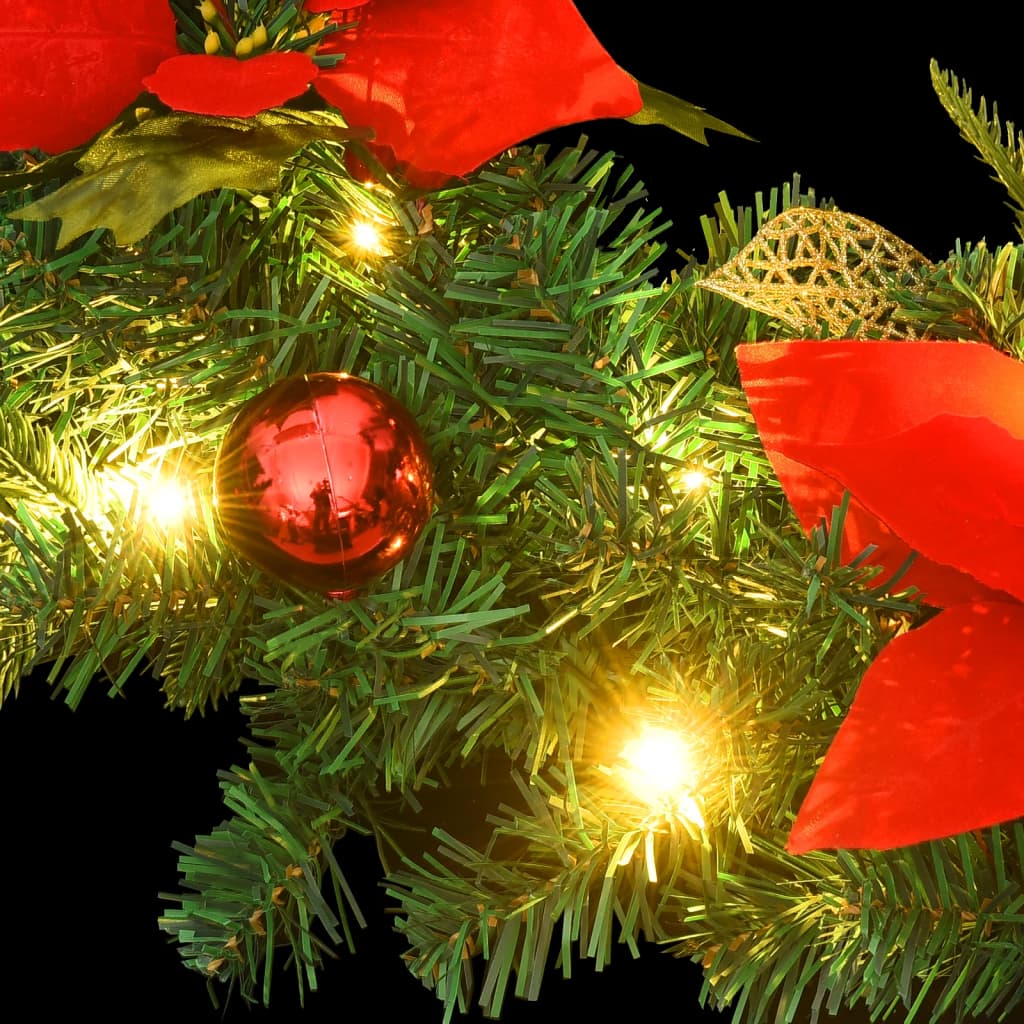 A 23.6-inch green PVC Christmas wreath with red poinsettias, ornaments, and integrated LED lights.