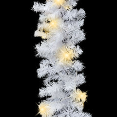 White 16 ft PVC Christmas garland with warm LED lights on bendable branches.