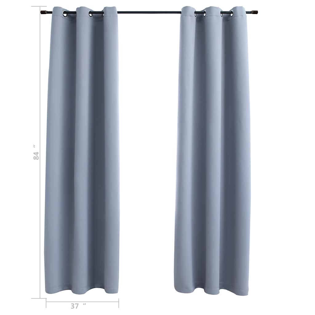 Two gray blackout curtain panels, 37x84 inches each, with rings on a rod.