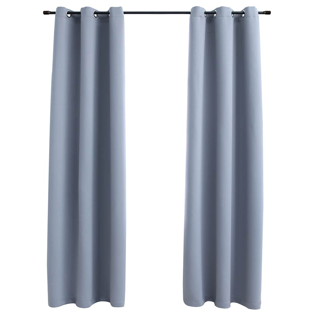 Two gray blackout curtain panels with metal rings, each 37x95 inches, hung on a rod.