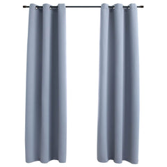 Two gray blackout curtain panels with metal rings, each 37x95 inches, hung on a rod.