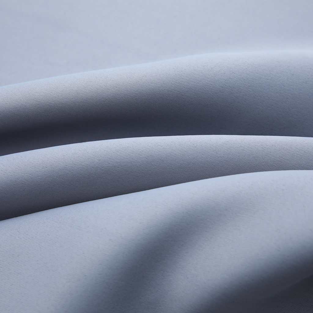 Two gray blackout curtain panels, 54x84 inches each, with metal rings.