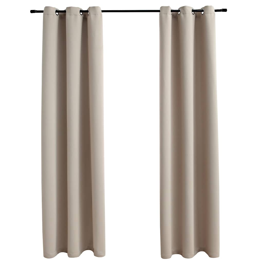 Two beige blackout curtain panels, 37x63 inches each, with metal rings on a rod.