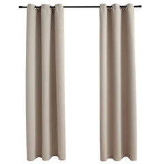 Two beige blackout curtain panels, 37x63 inches each, with metal rings on a rod.