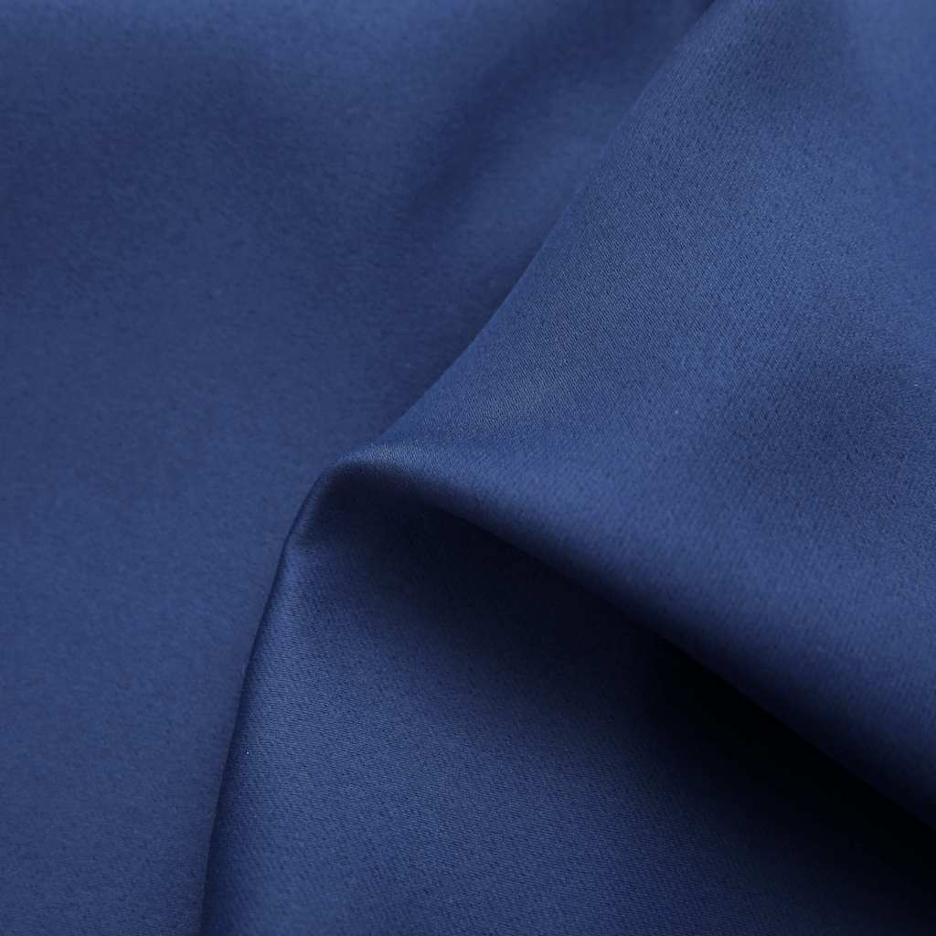 Close-up of navy blue blackout curtain fabric with subtle texture and folds.
