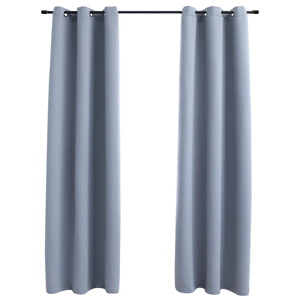 Two gray blackout curtain panels, 37x63 inches each, with rings on a rod.