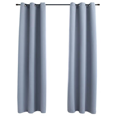 Two gray blackout curtain panels, 37x63 inches each, with rings on a rod.