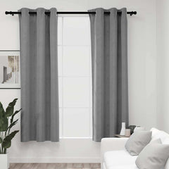 Two gray velvet blackout curtains, 37x95 inches, hung on a rod with rings in a bright living room.