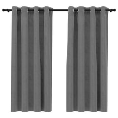 Pair of gray velvet blackout curtains, 54x63 inches each, with rings on a rod.
