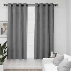 Two gray velvet blackout curtains, 54x63 inches each, hung on a rod with rings in a modern living room.