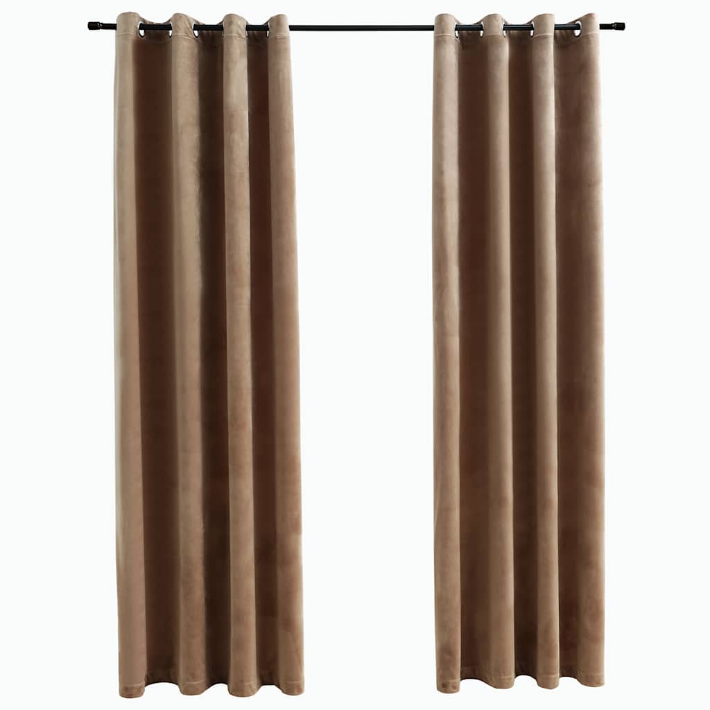 Pair of beige velvet blackout curtains, 54x84 inches each, with rings on a rod.