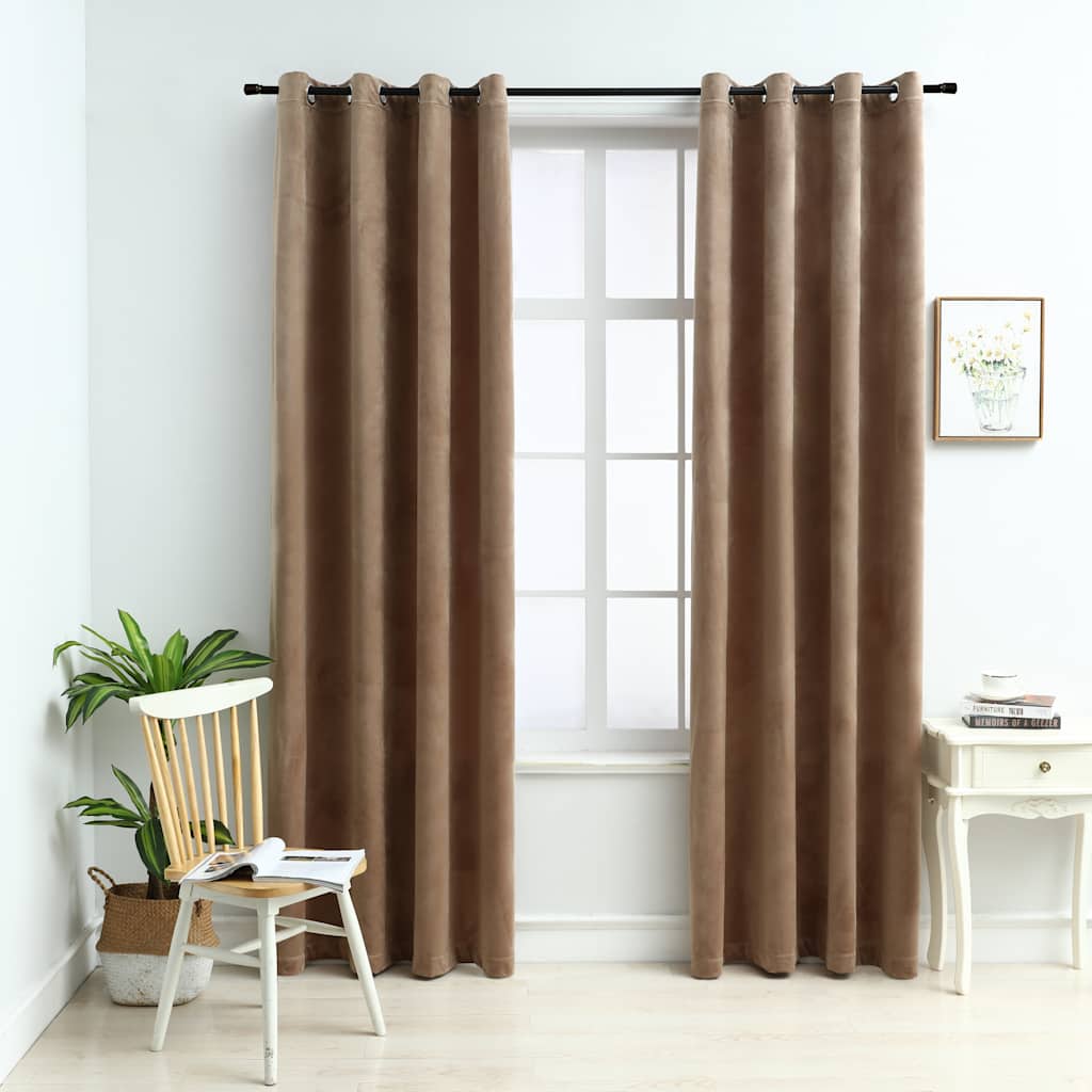 Two beige velvet blackout curtains, 54x84 inches each with rings, hanging in a light room.