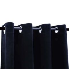 Two navy black velvet blackout curtain panels, 54x63 inches, hung on a rod with rings.