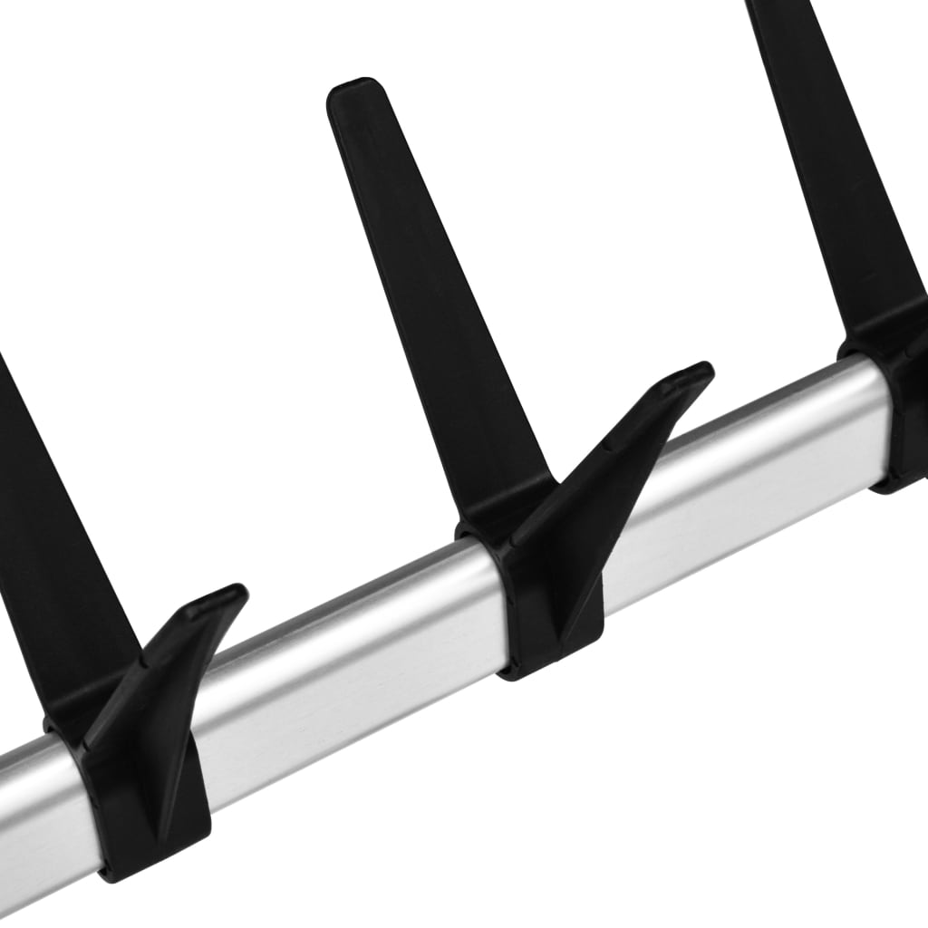 Silver telescopic aluminum shoe rack with adjustable rods for organized storage.