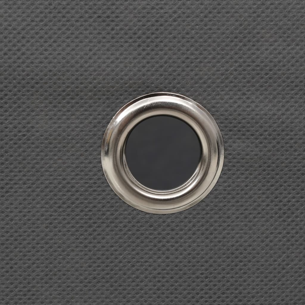 Gray non-woven fabric storage box with silver metal eyelet on textured surface.