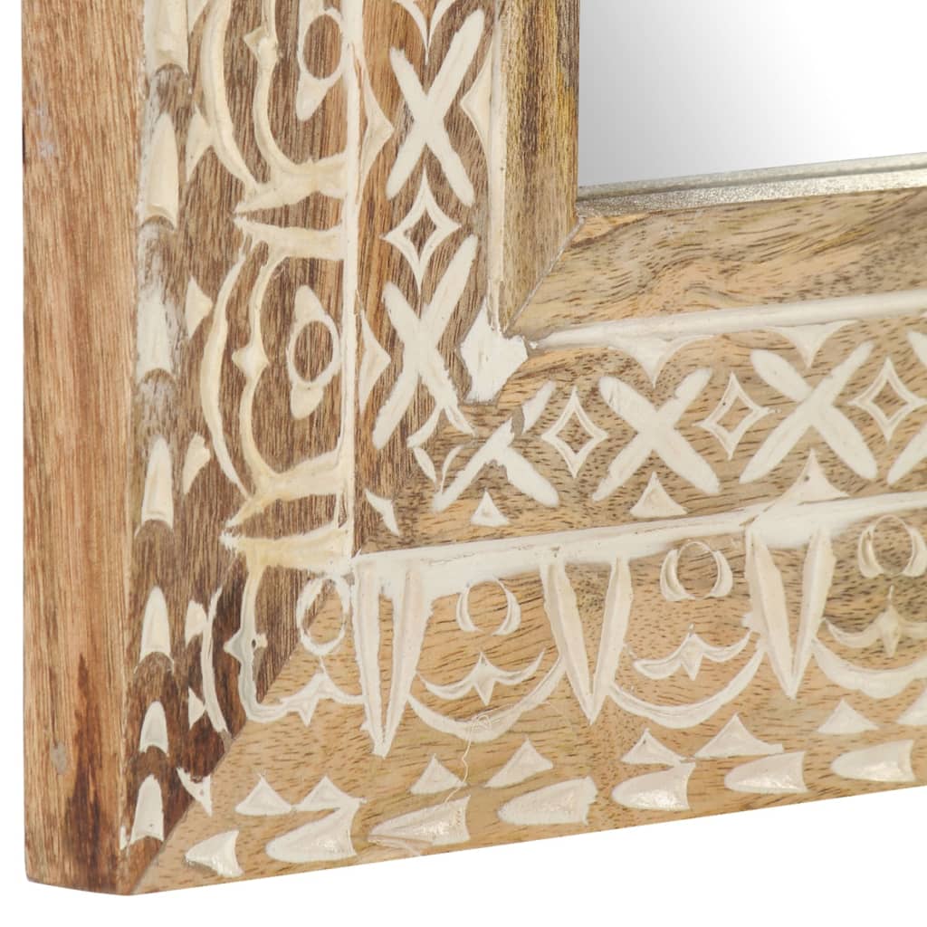 Square hand-carved mango wood mirror with intricate white patterns on a natural wood frame.