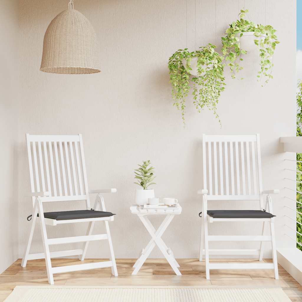 Two anthracite Oxford fabric garden chair cushions with black seats on white folding chairs.