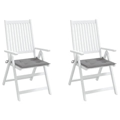 Two white wooden folding chairs with gray seat cushions are shown.