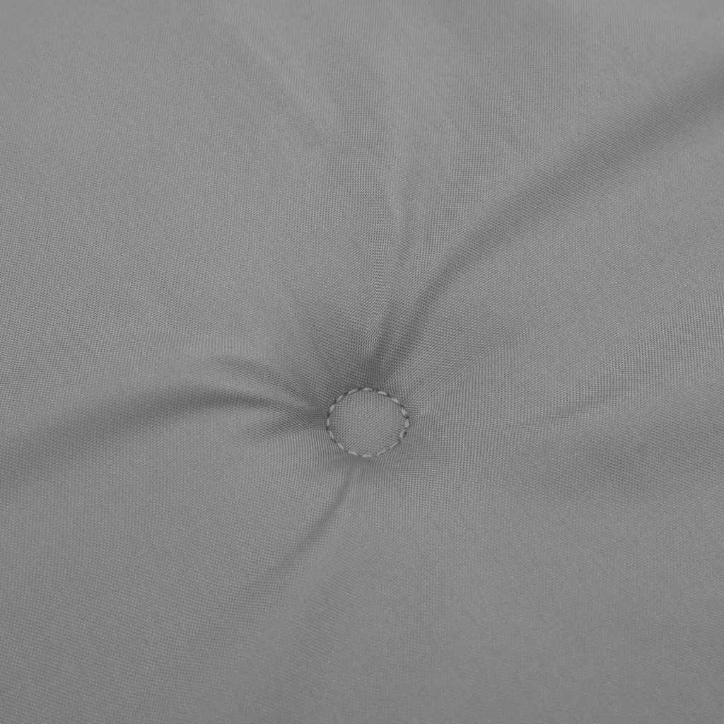 A close-up of a gray tufted cushion made of Oxford fabric.