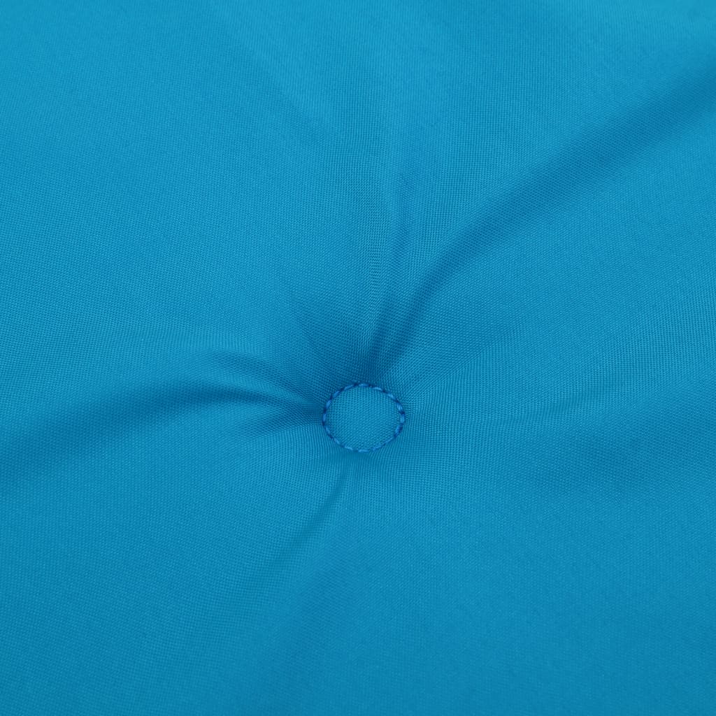 Close-up of a tufted blue polyester high-back chair cushion.