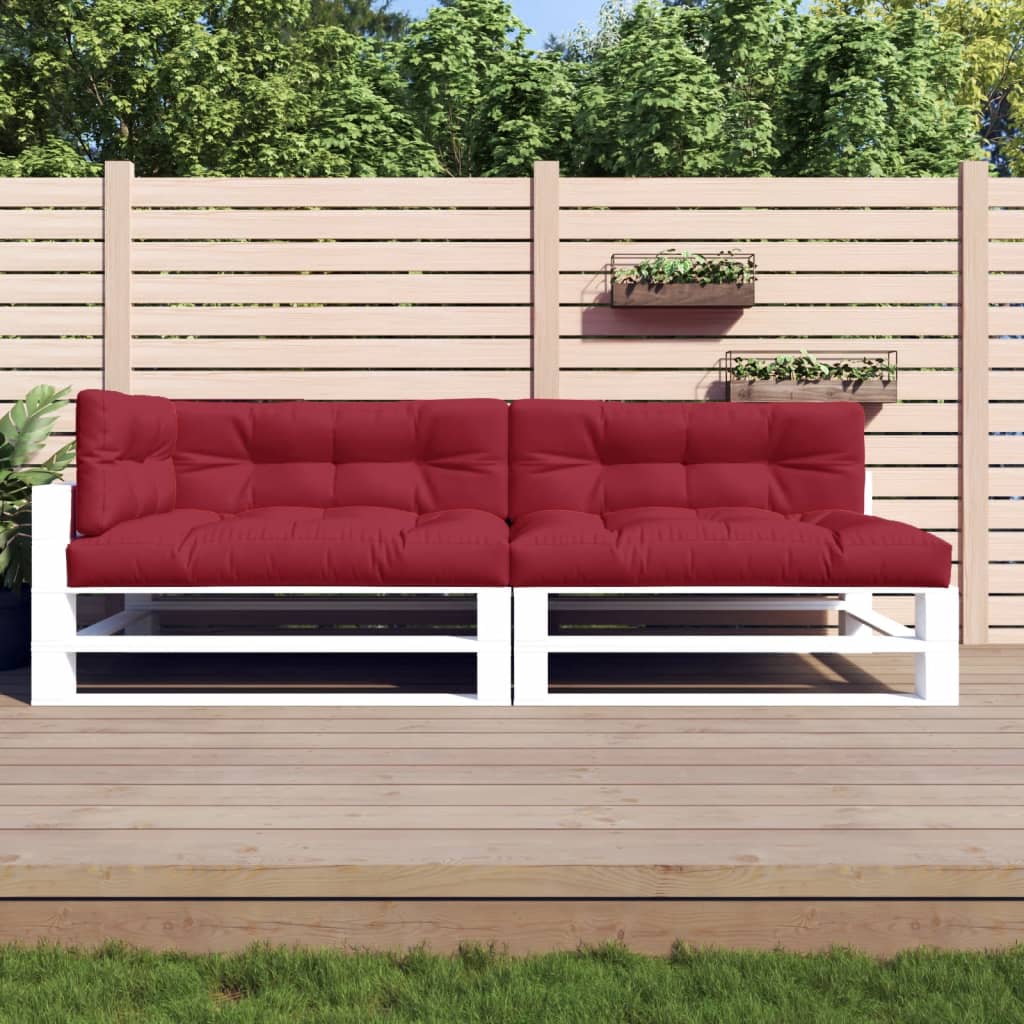 A set of five wine red polyester pallet cushions on a white pallet sofa.