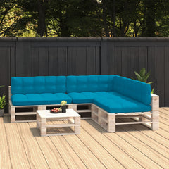 Blue fabric cushions on a wooden pallet L-shaped sofa set with coffee table on deck.