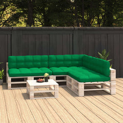 Green fabric cushions on a wooden pallet L-shaped outdoor sofa set with coffee table on deck.