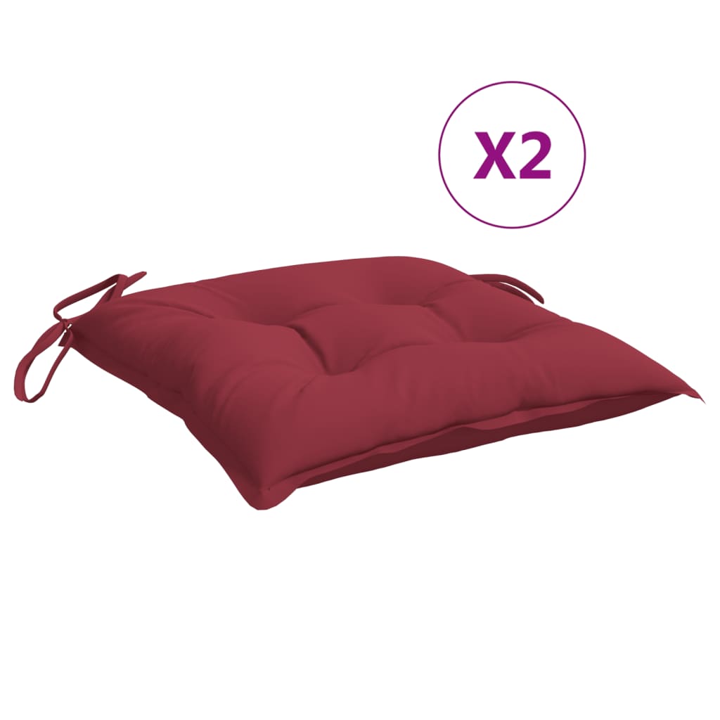 Two wine red square chair cushions with ties are shown on a white background.