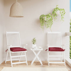 Two wine red Oxford fabric chair cushions with ties, sized 15.7x15.7x2.8 inches, on white patio chairs.