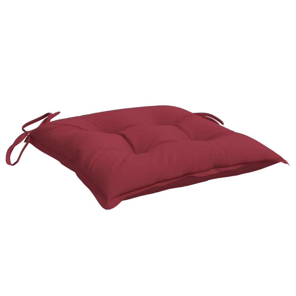 A single wine red chair cushion with ties is shown at an angle.