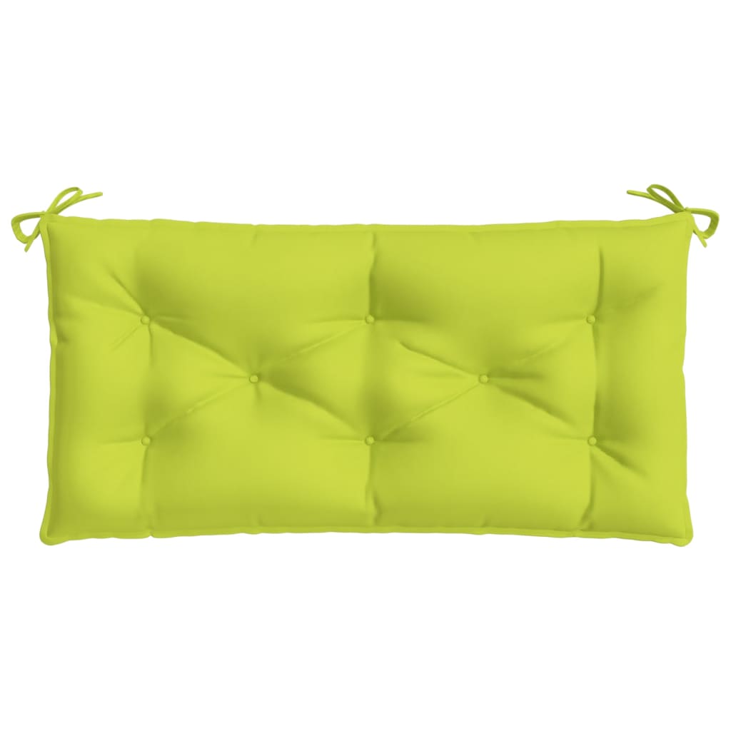 A bright green tufted garden bench cushion with ties on each end.