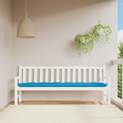 Light blue Oxford fabric garden bench cushion on white wooden bench.