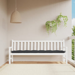 Black bench cushion in Oxford fabric on white garden bench in sunny balcony setting.