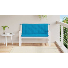 Light blue Oxford fabric garden bench cushion with tufted design and tie-down straps.