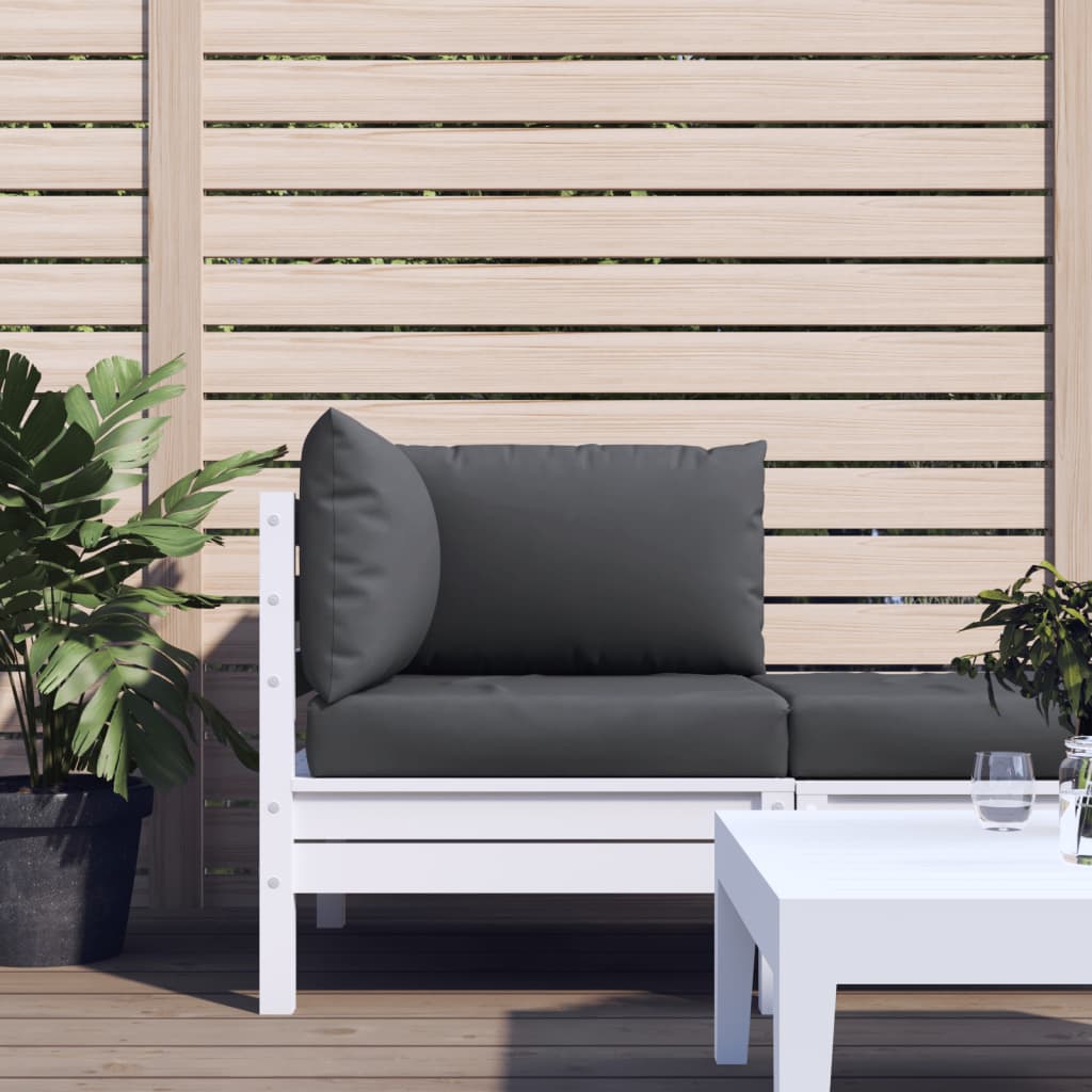 Three anthracite Oxford fabric cushions on a white pallet sofa against a wooden fence.
