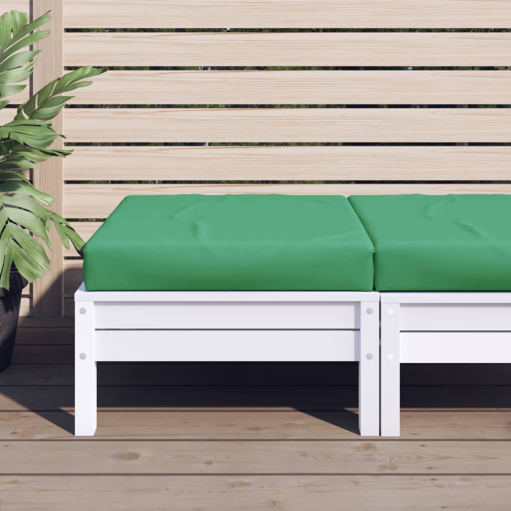 Green water-resistant Oxford fabric cushion on white wooden pallet bench outdoors.