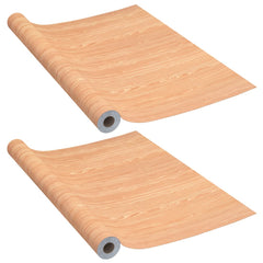Self-adhesive PVC film in Ahorn wood-look, perfect for doors and furniture, in two rolls.