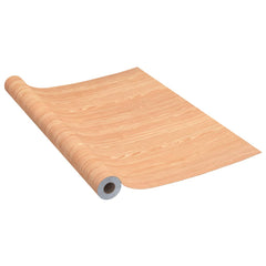 Self-adhesive PVC film with Ahorn wood-look design, suitable for doors and furniture.