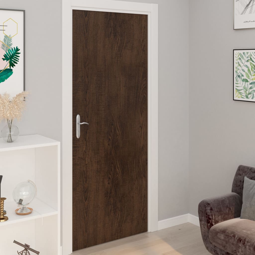 Self-adhesive PVC door film in dark oak wood grain, four rolls for easy application.