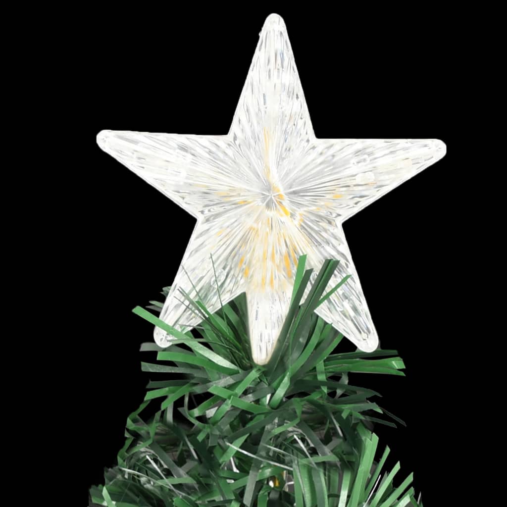 A 6 ft pre-lit fiber optic Christmas tree with white star topper and green tinsel base on a black background.