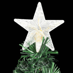 A 6 ft pre-lit fiber optic Christmas tree with white star topper and green tinsel base on a black background.