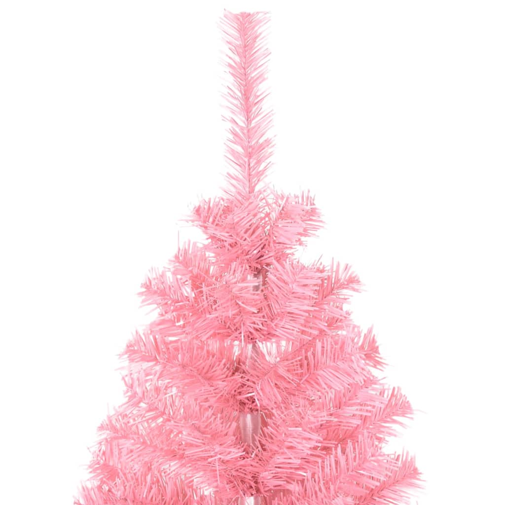 A close-up of the top section of a pink artificial Christmas tree.