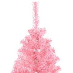 A close-up of the top section of a pink artificial Christmas tree.