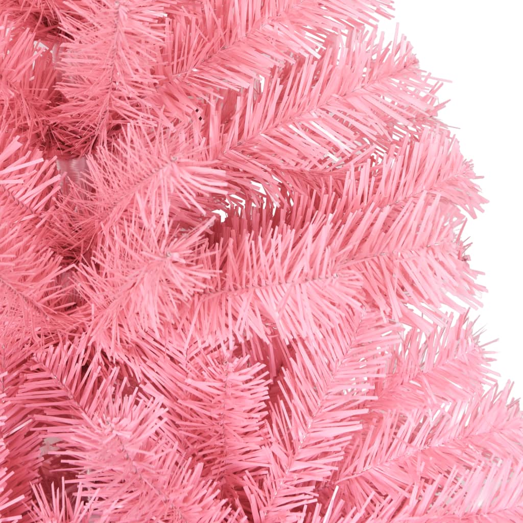A close-up view of the dense, pink PVC needles of an artificial Christmas tree.