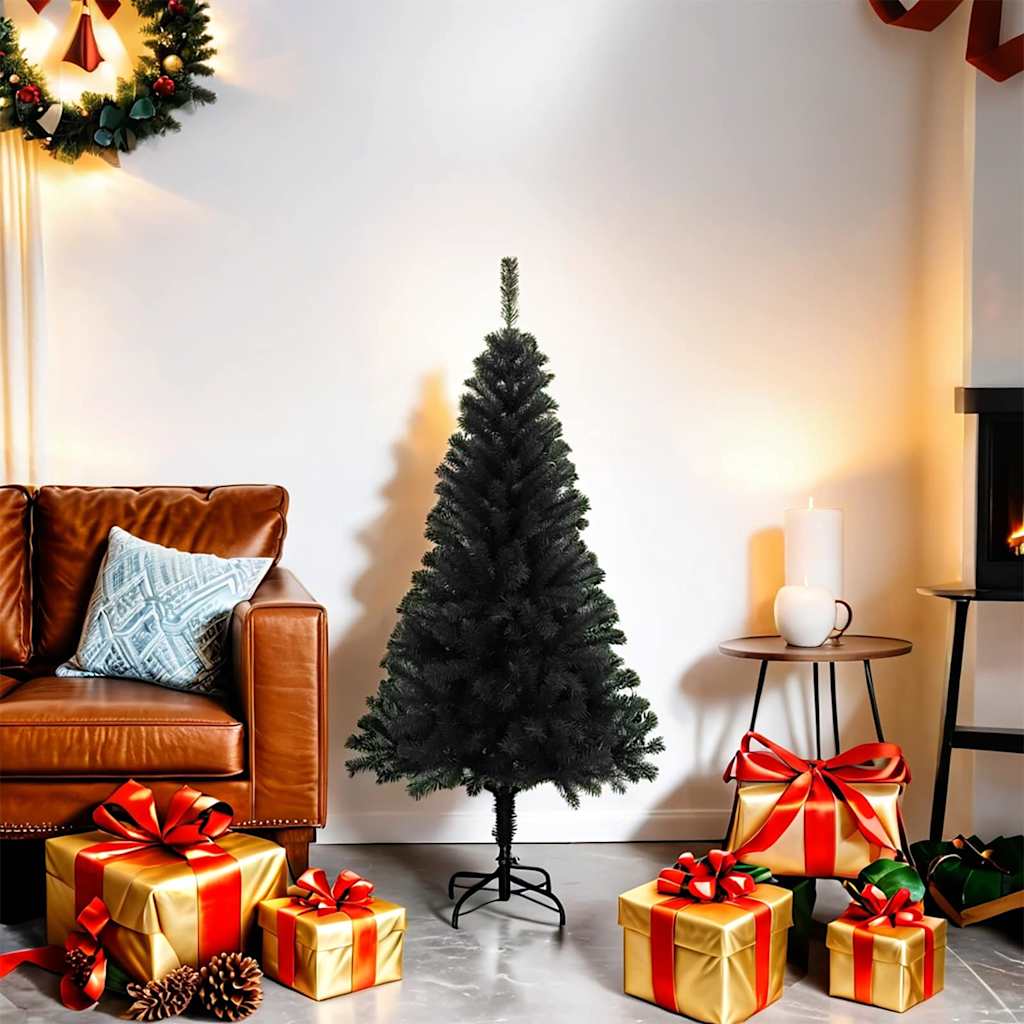 A 4 ft black artificial Christmas tree on a PVC stand in a cozy living room with holiday decorations.